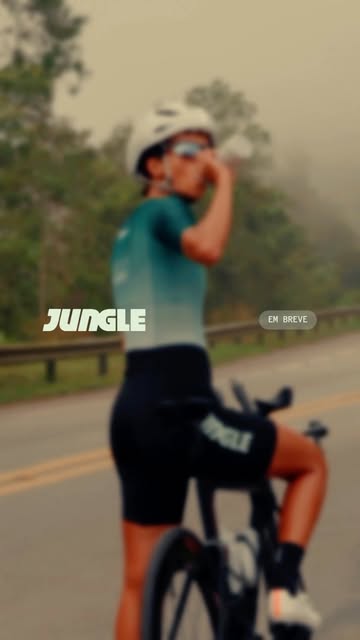 Capa de Reel da Jungle com bicicleta e estrada.